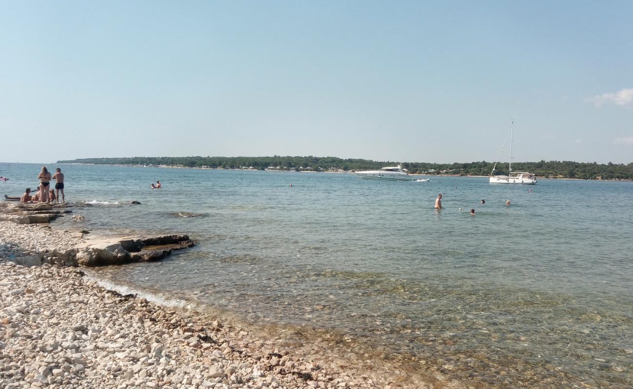 Foto de Porat beach con guijarro ligero superficie