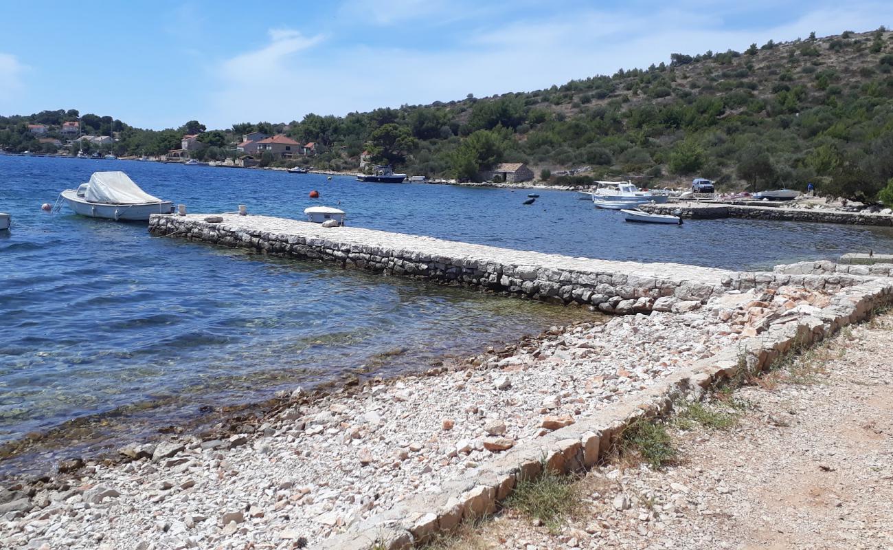 Foto de Porto Rosso beach con guijarro fino claro superficie