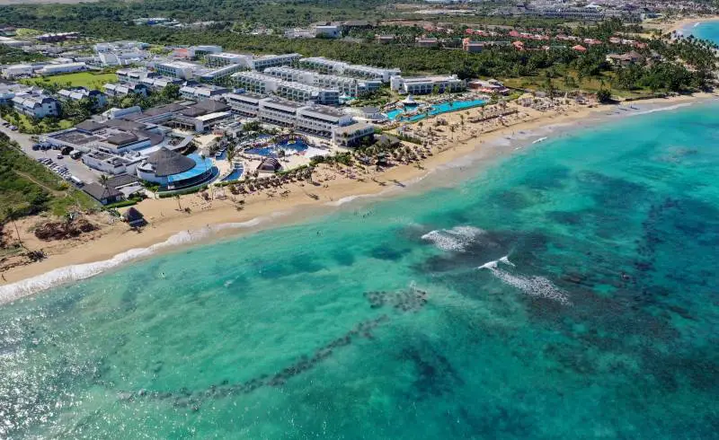 Foto de Playa Las Muñecas con brillante arena fina superficie