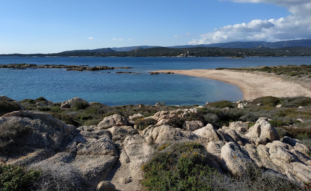 Foto de La Testa beach X con arena brillante y rocas superficie