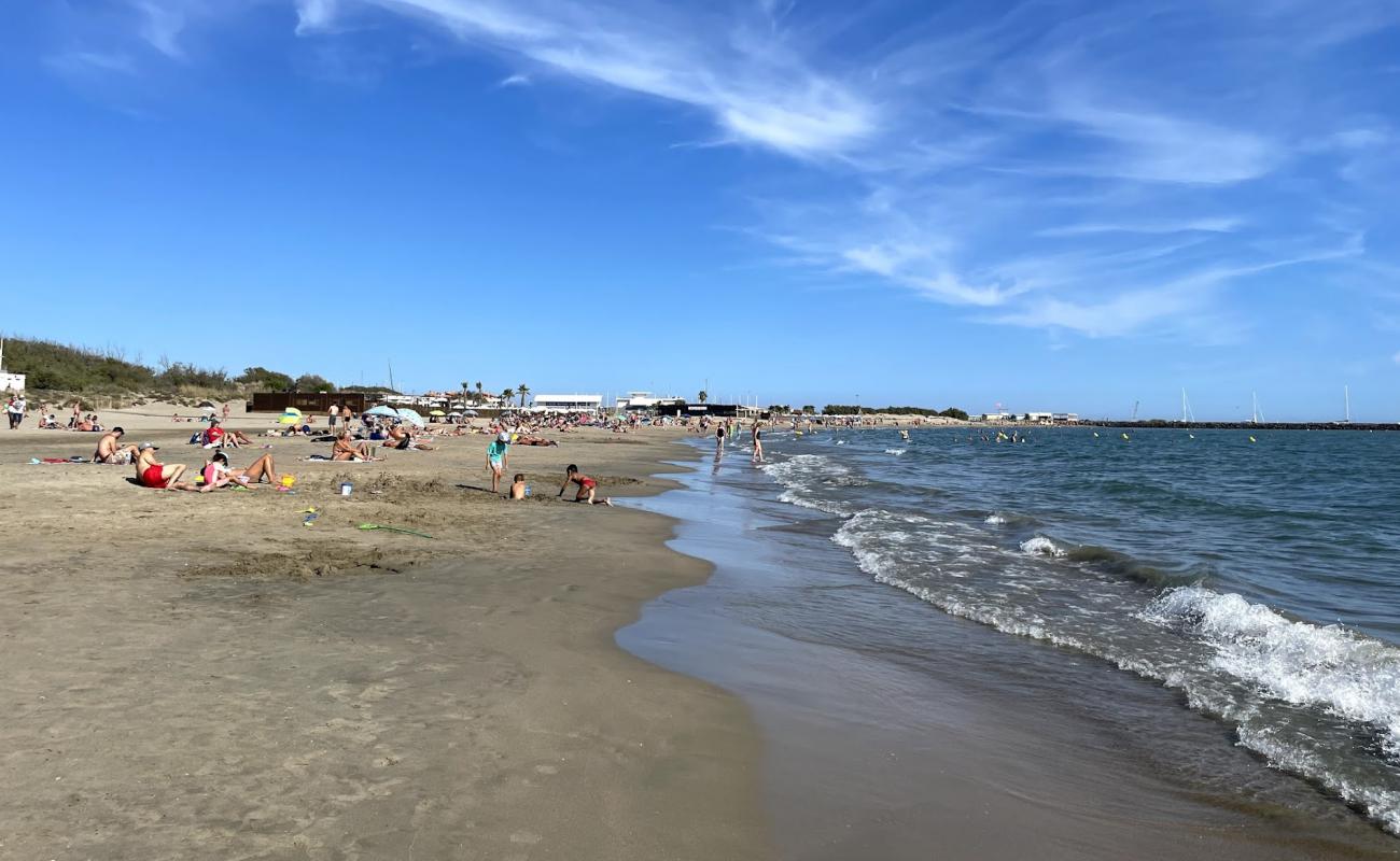 Foto de Playa Manovi con arena brillante superficie