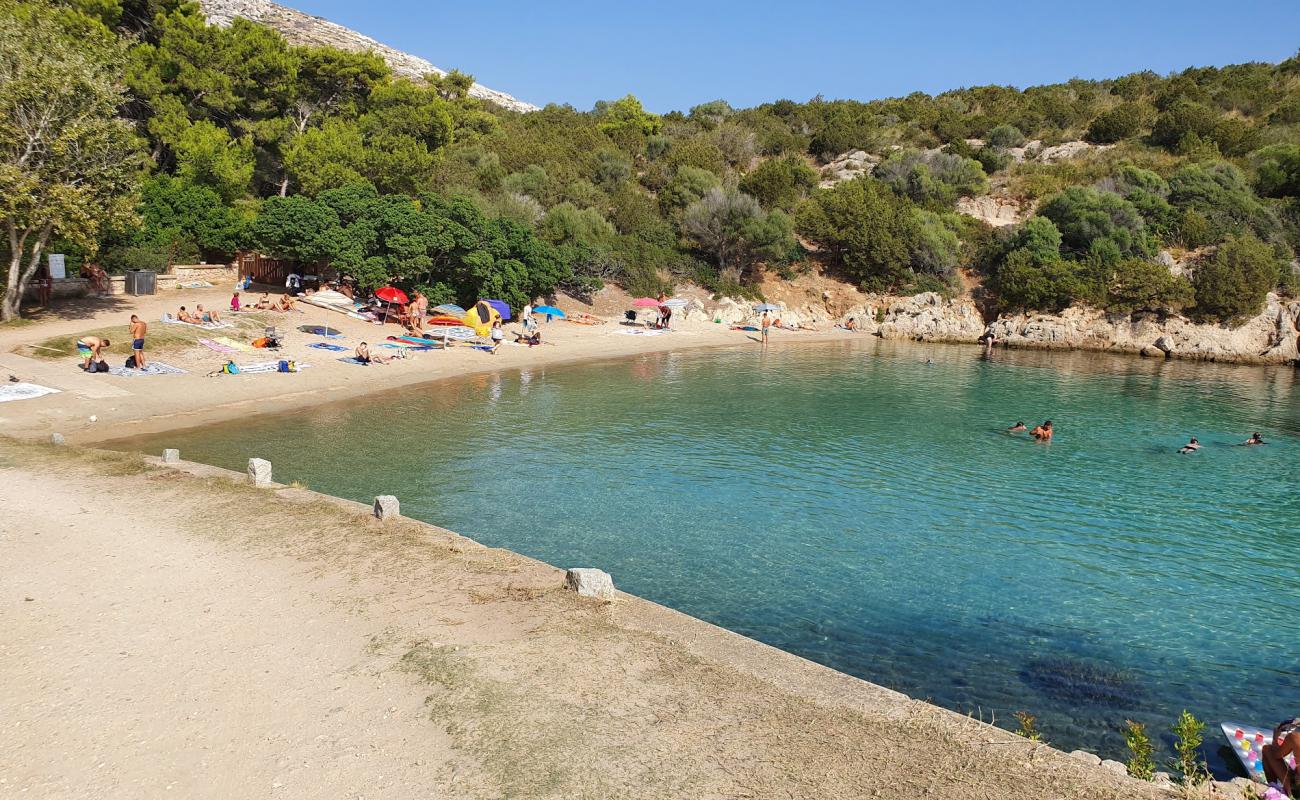 Foto de Playa Cala Moresca con arena fina y guijarros superficie