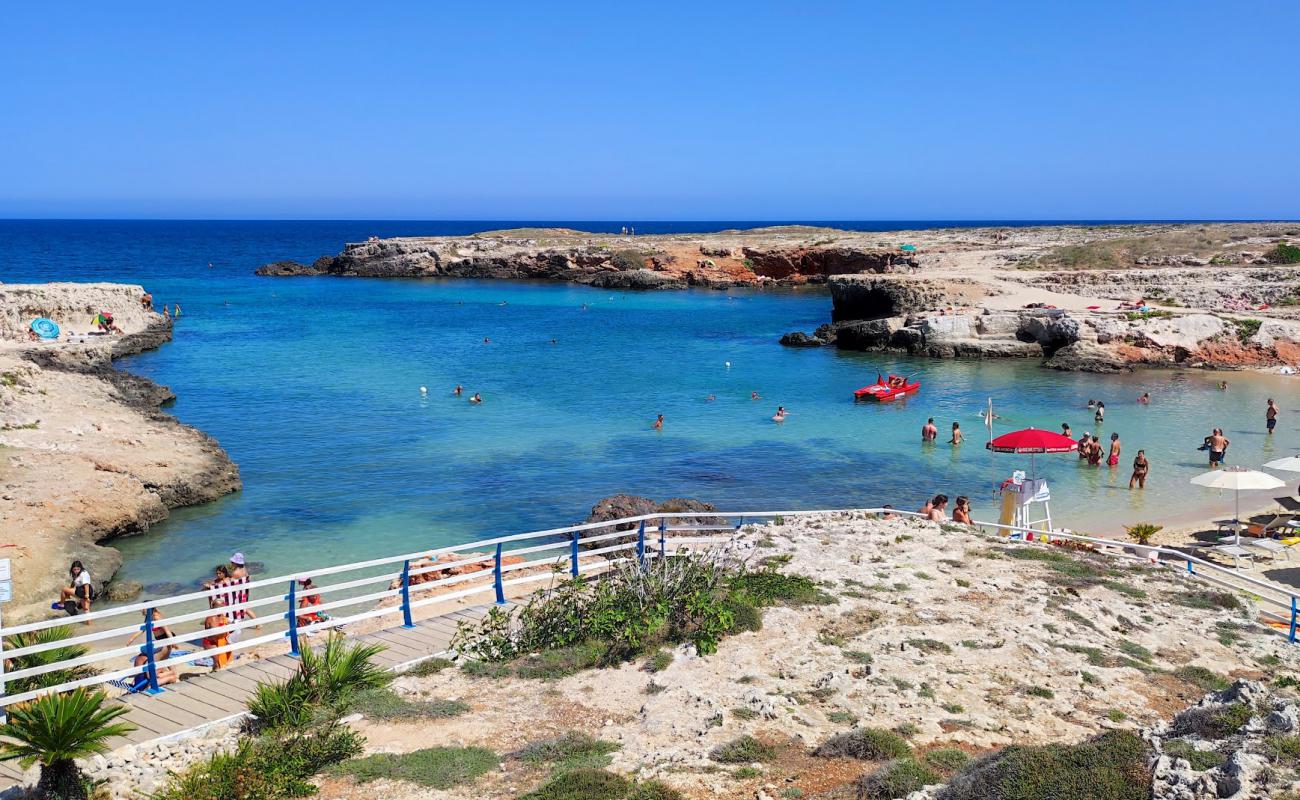 Foto de Cala Paradiso con arena brillante superficie