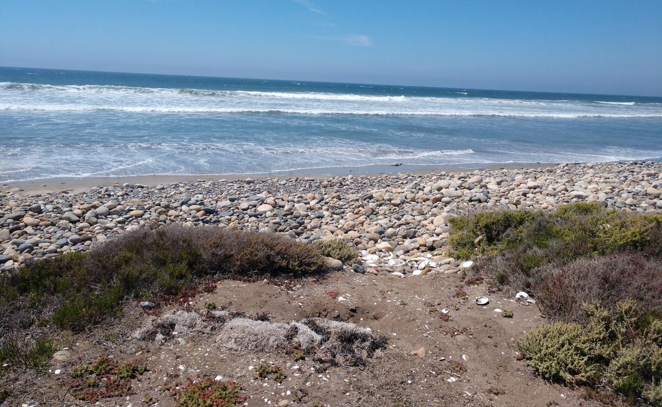 Foto de Playa El Socorrito con arena/guijarros negro superficie