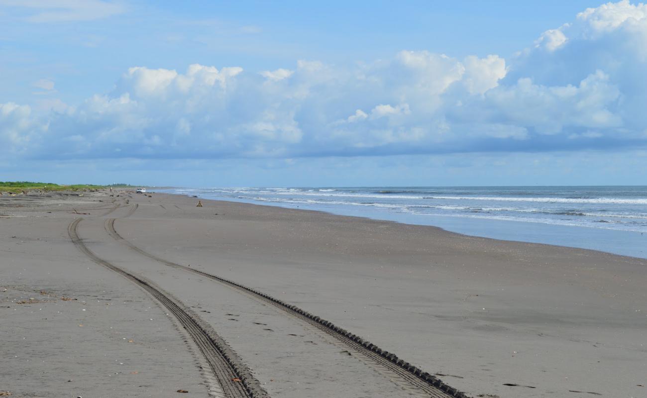 Foto de Los Corchos beach con arena brillante superficie