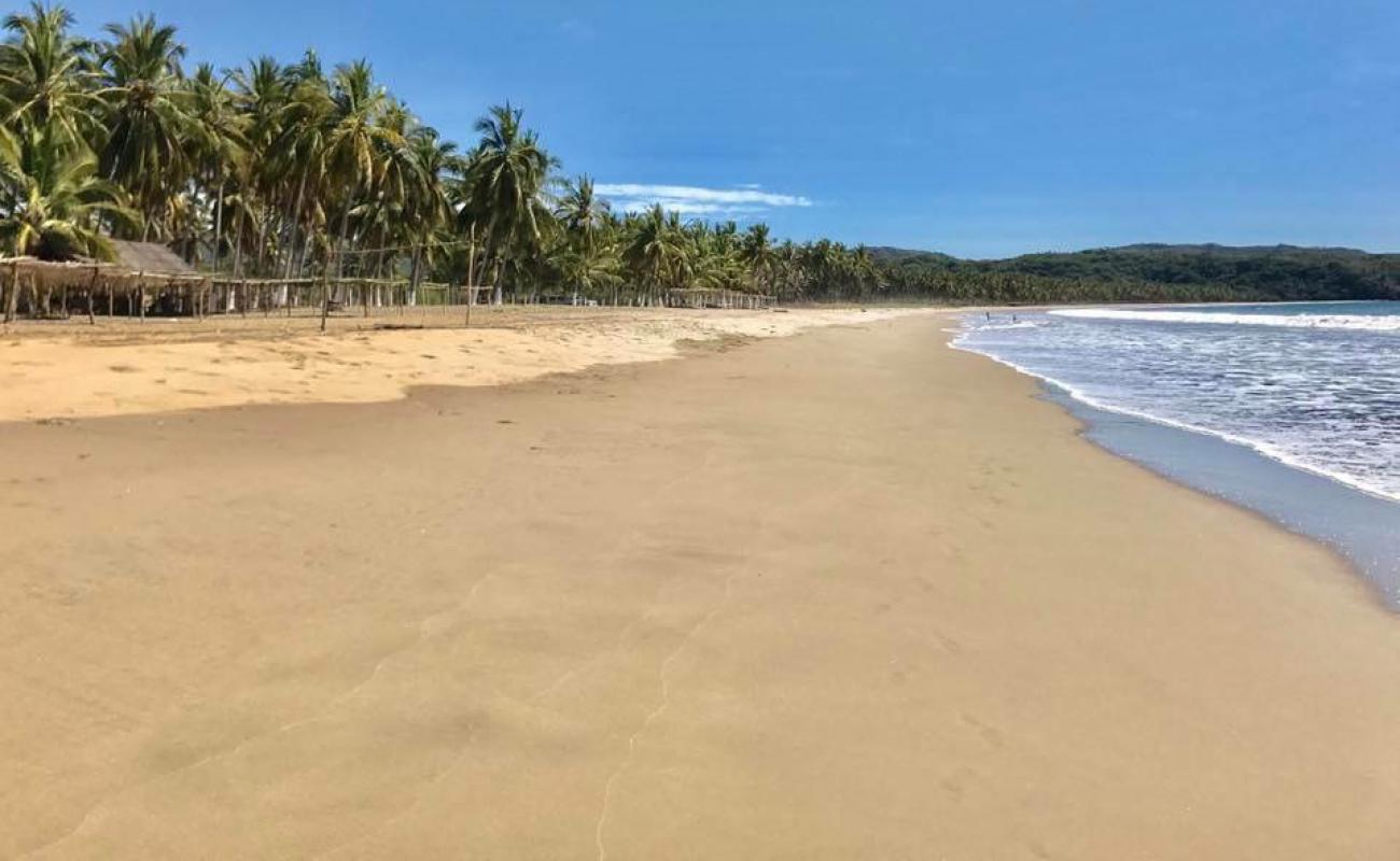 Foto de Limoncito beach con brillante arena fina superficie