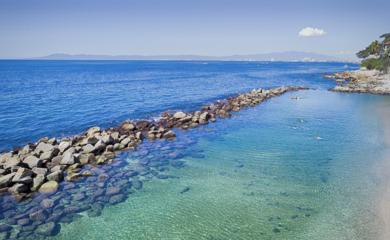 Foto de Costa Sur II beach con arena/piedras marrón superficie