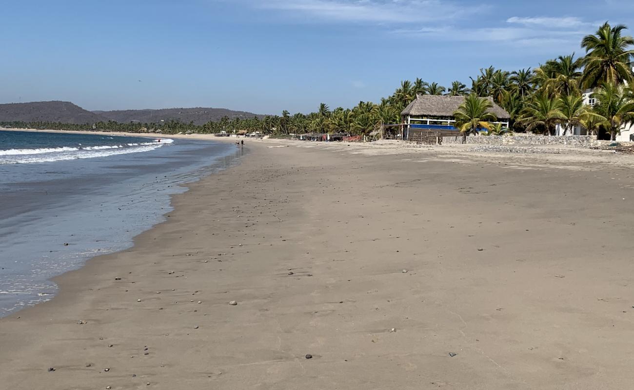 Foto de Playa La Manzanilla con arena fina oscura superficie