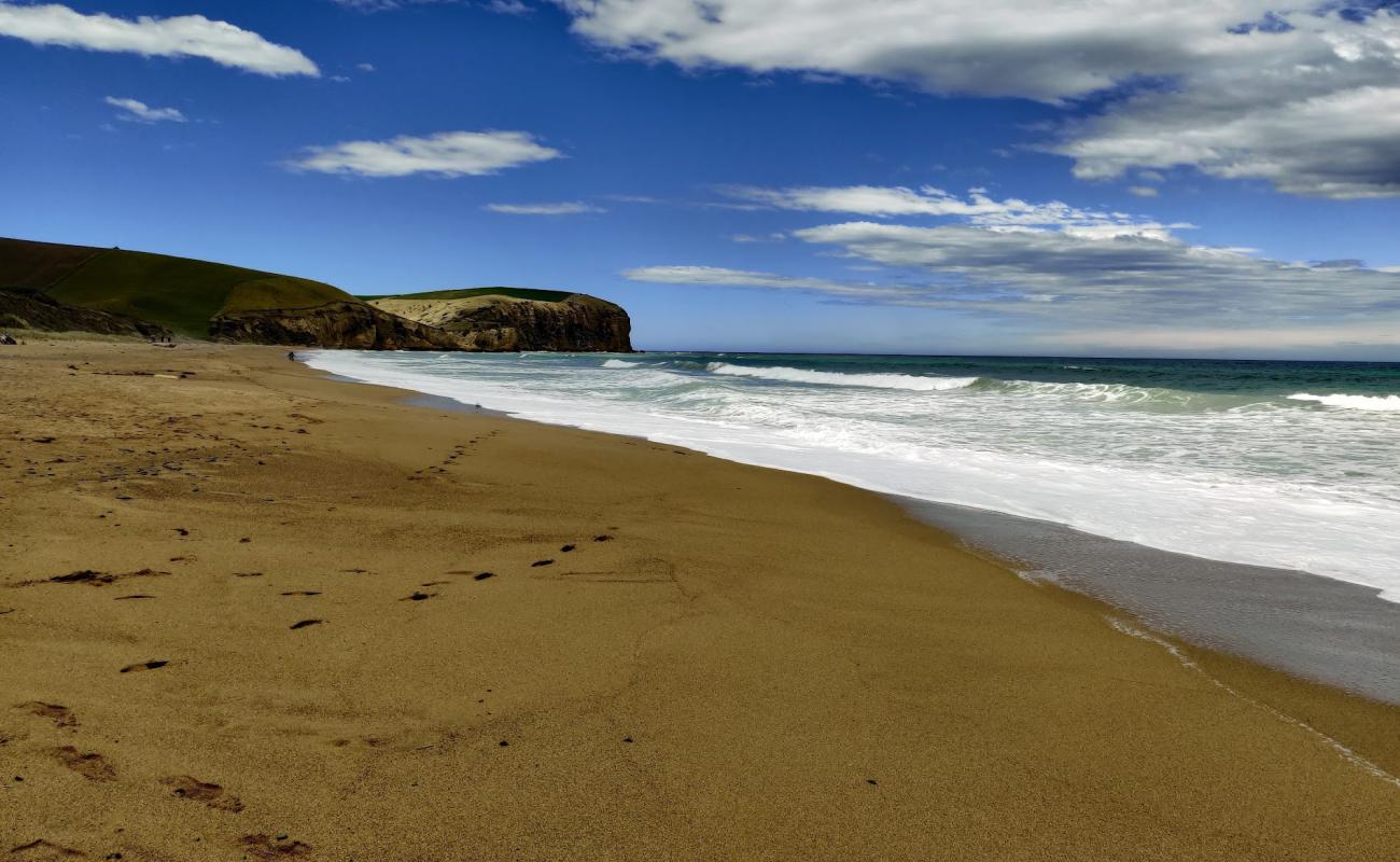 Foto de S14 Beach con arena brillante superficie