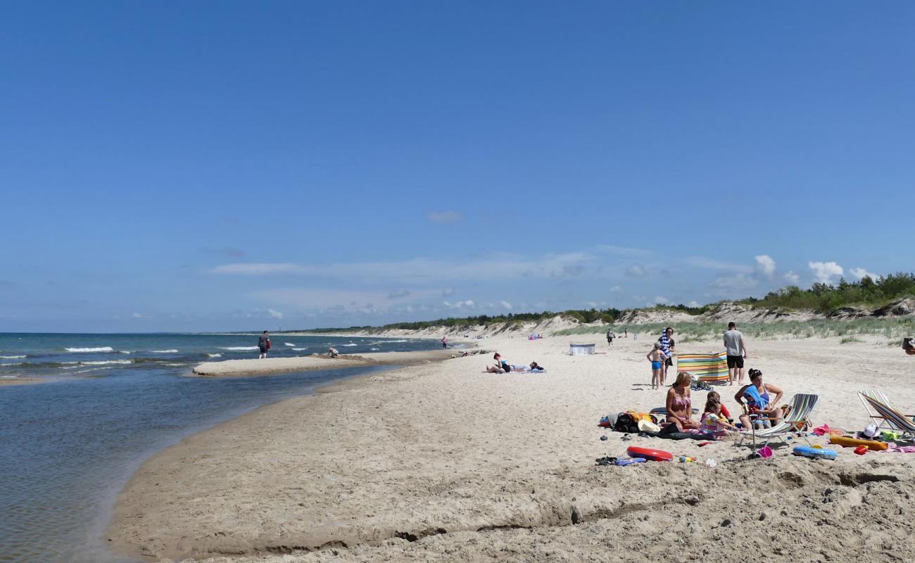 Foto de Naturystyczna Beach con arena brillante superficie