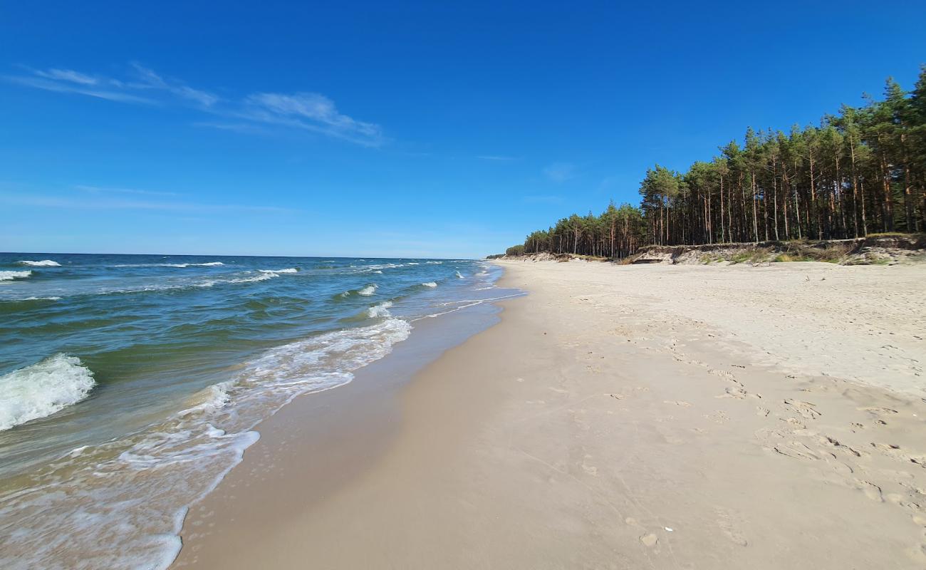 Foto de Ulinia Beach con arena fina blanca superficie