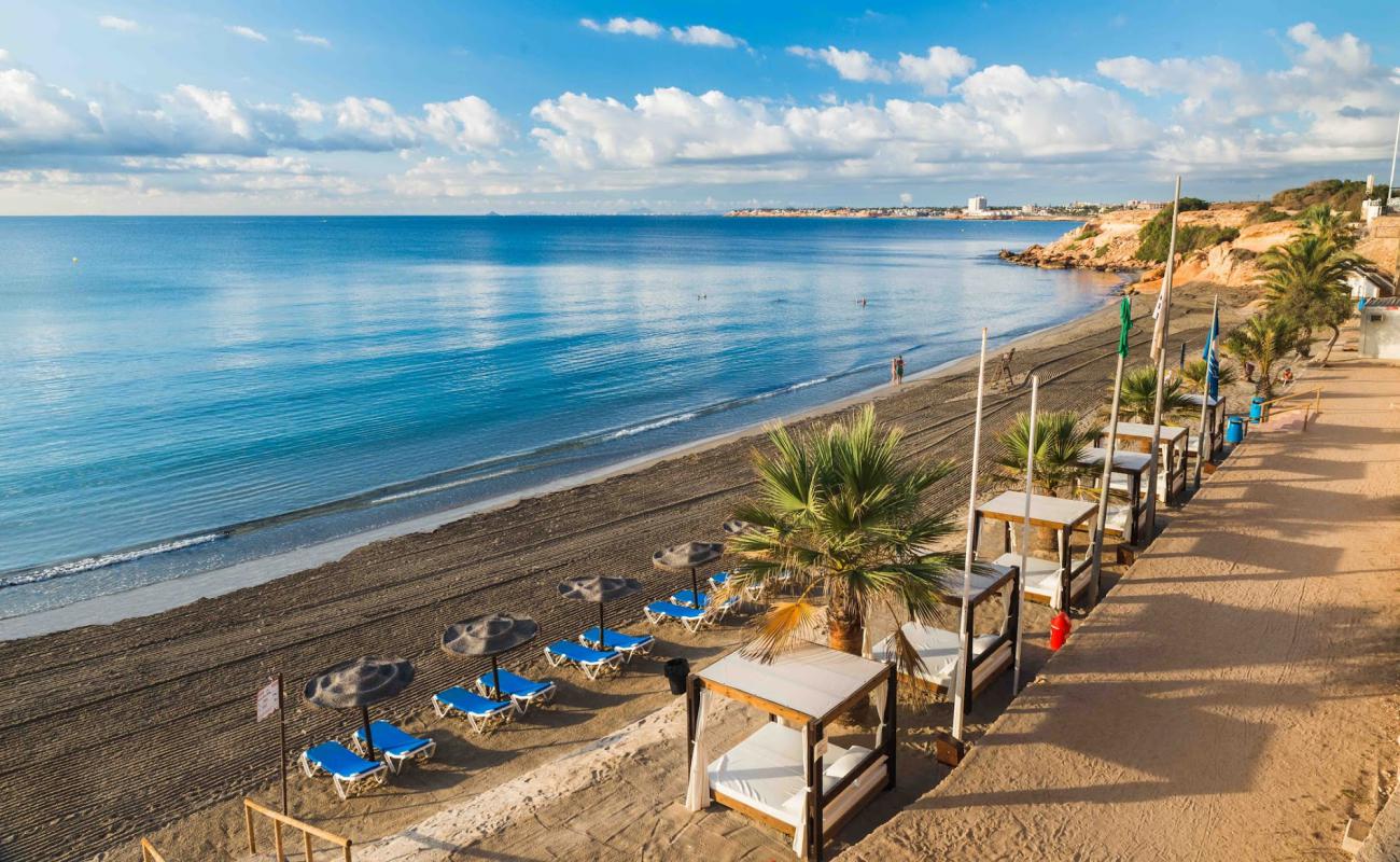 Foto de Playa Punta Prima con arena oscura superficie