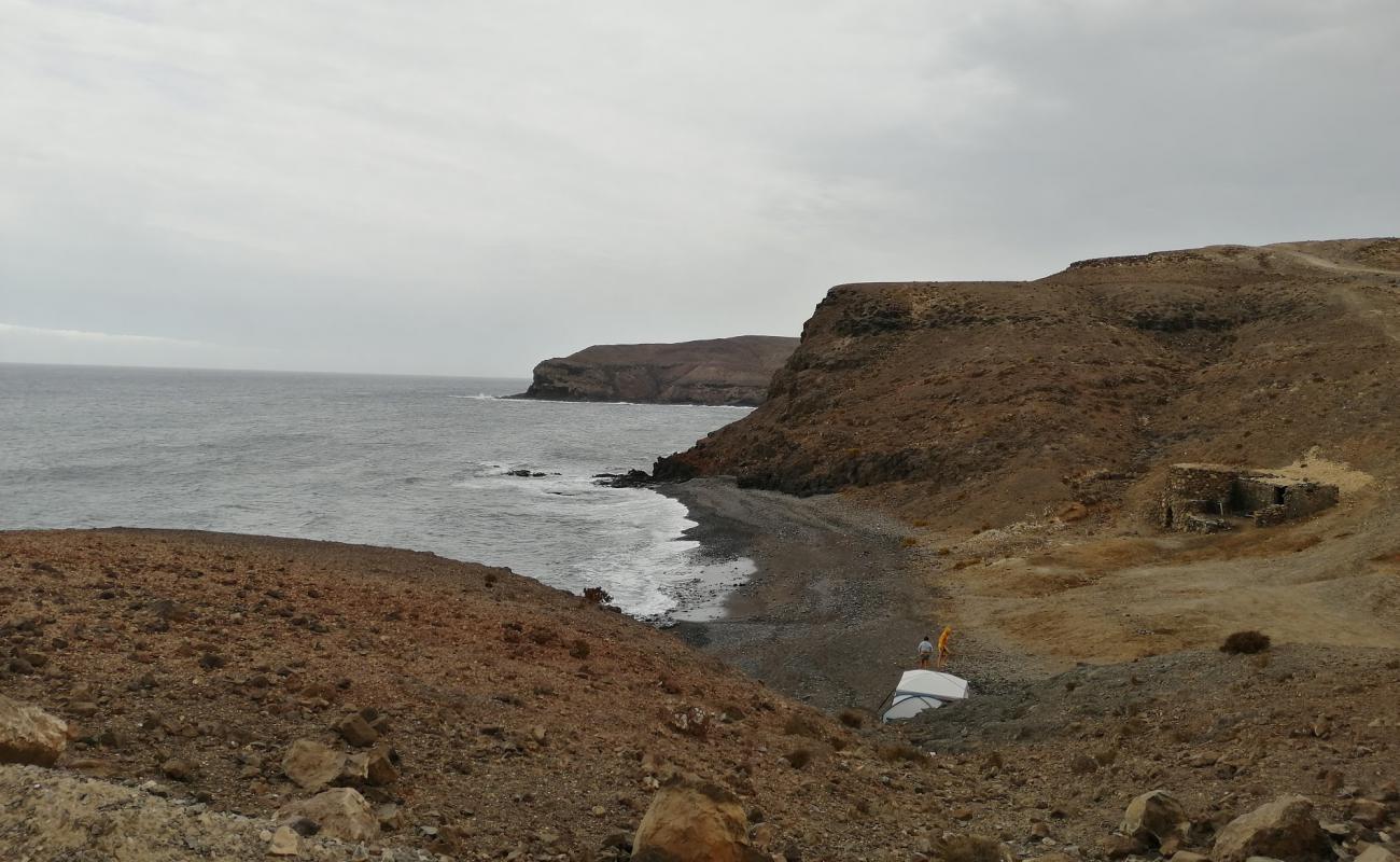 Foto de Playa Majada de las Cabras con arena gris y piedras superficie