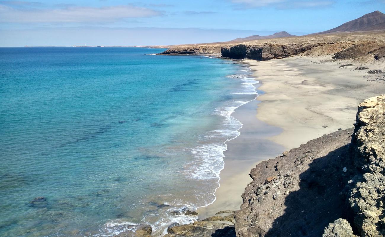 Foto de Playa Juan Gomez con brillante arena fina superficie