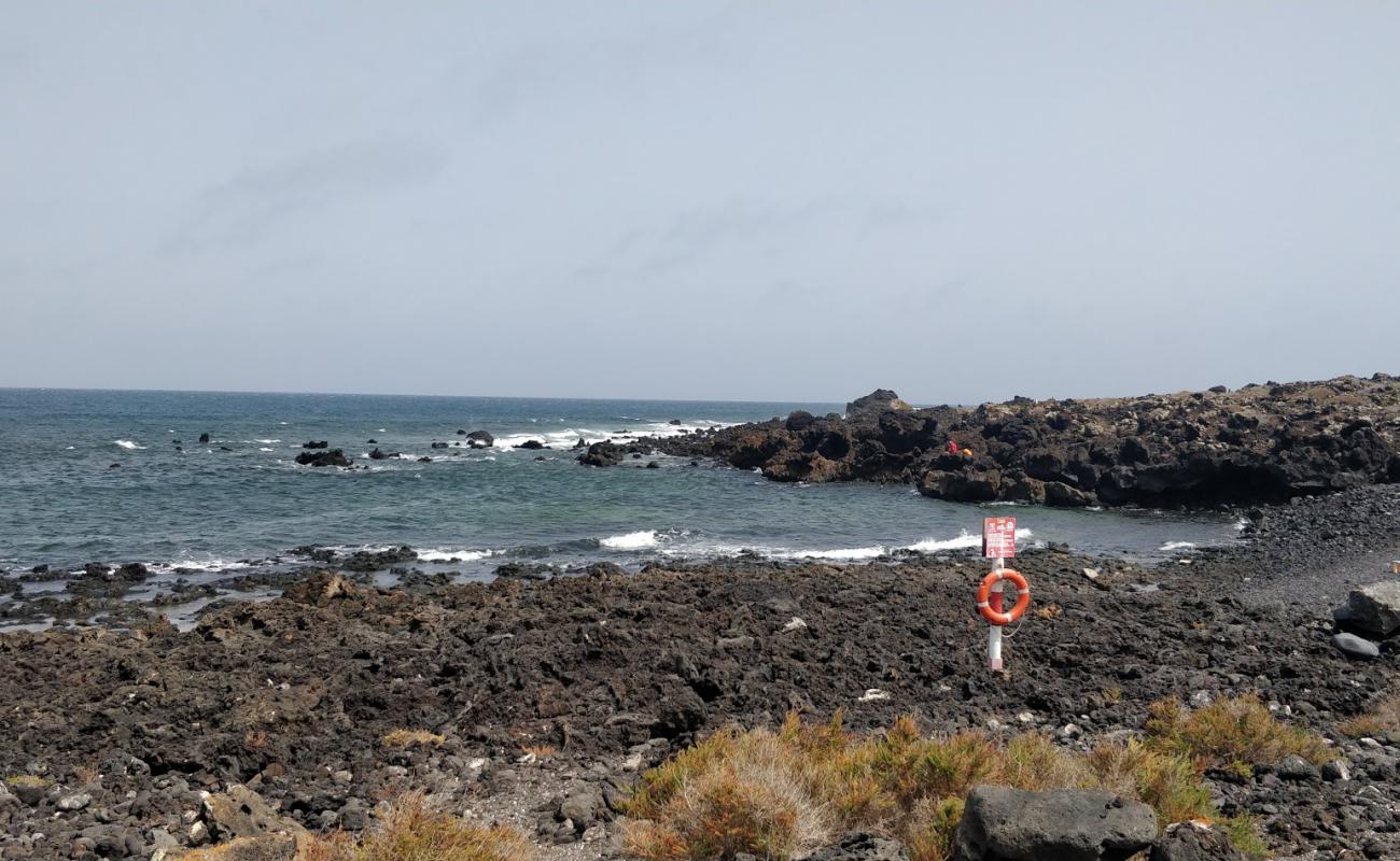 Foto de Caleta de las Escamas con piedra superficie