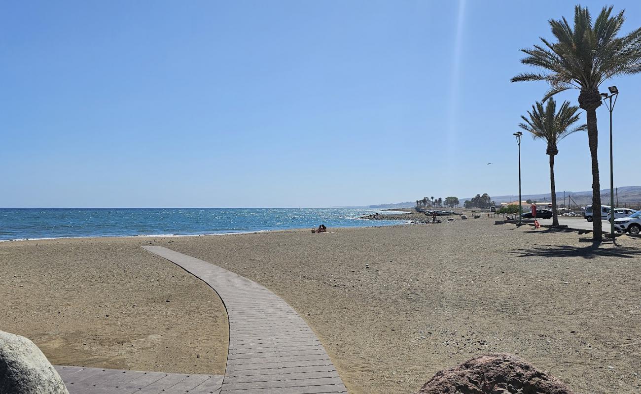 Foto de La Caleta Beach con arena gris superficie