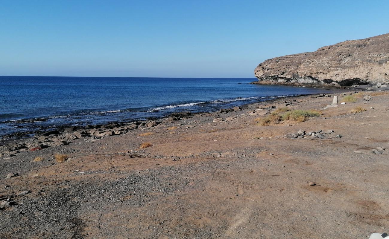 Foto de El Puertito Beach con arena gris y piedras superficie