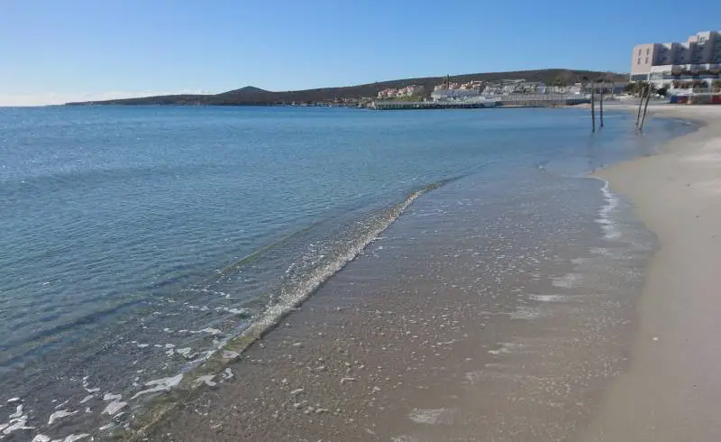 Foto de Playa Cark con brillante arena fina superficie