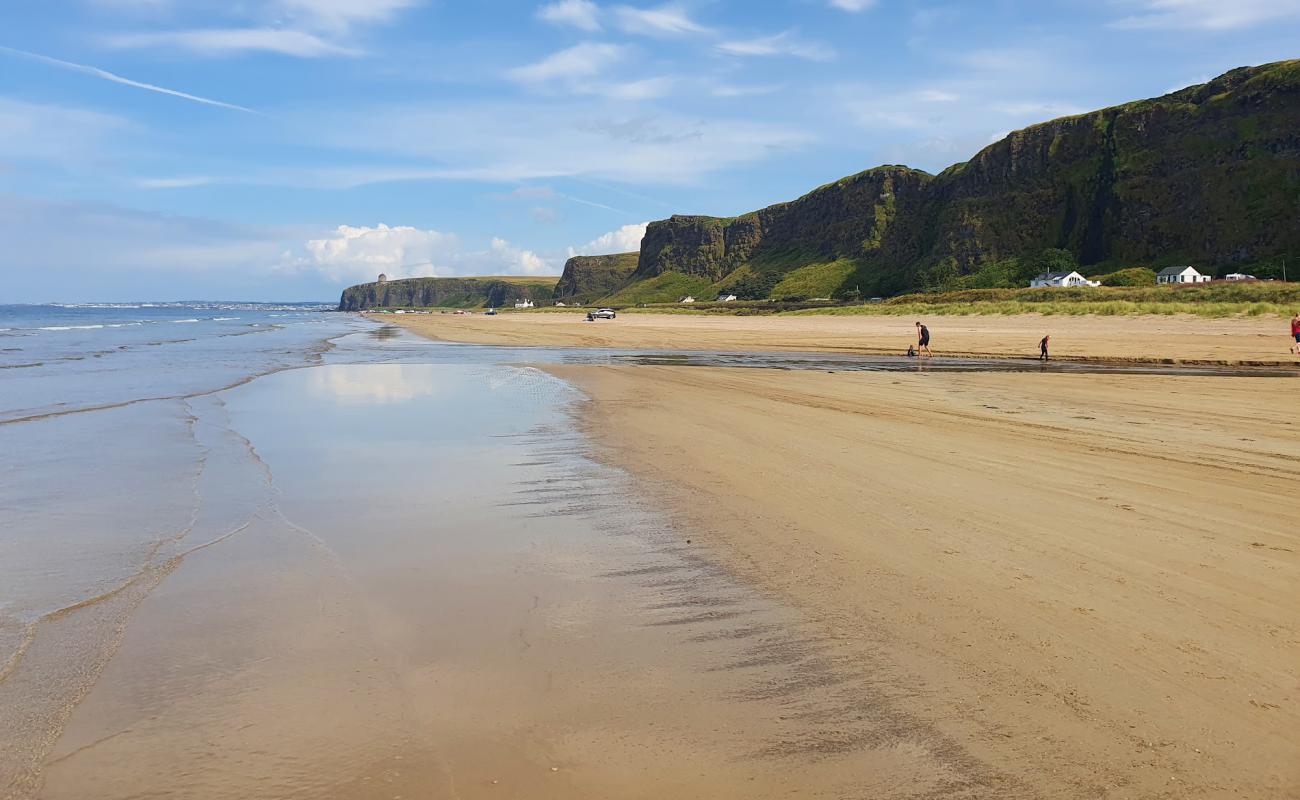 Foto de Playa de Benone con brillante arena fina superficie